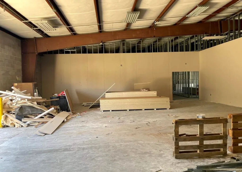 Commercial build-out in progress with framing and materials by Mint Construction Pros in Texas