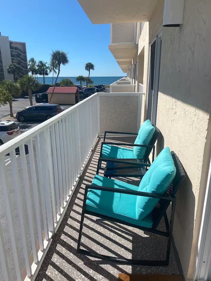 Balcony chairs with a view toward the Gulf