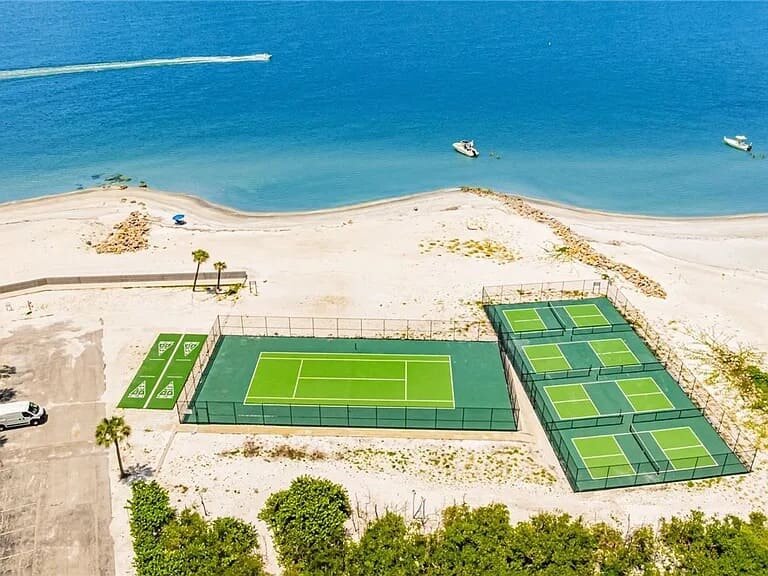Aerial view of the tennis and pickleball courts by the beach