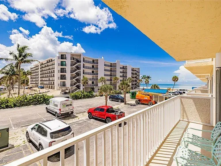 Balcony view of the neighboring buildings and the Gulf