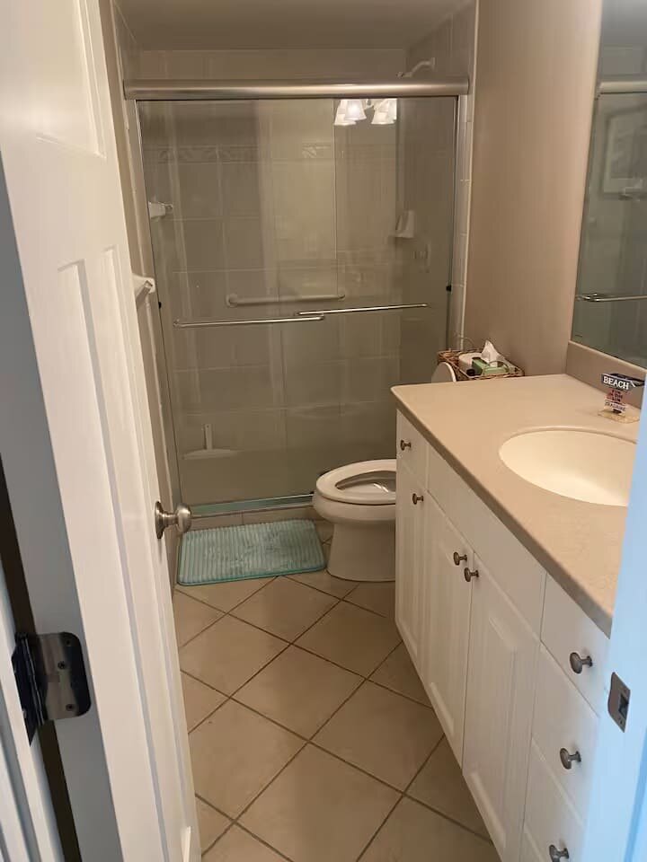 Bathroom with vanity and shower