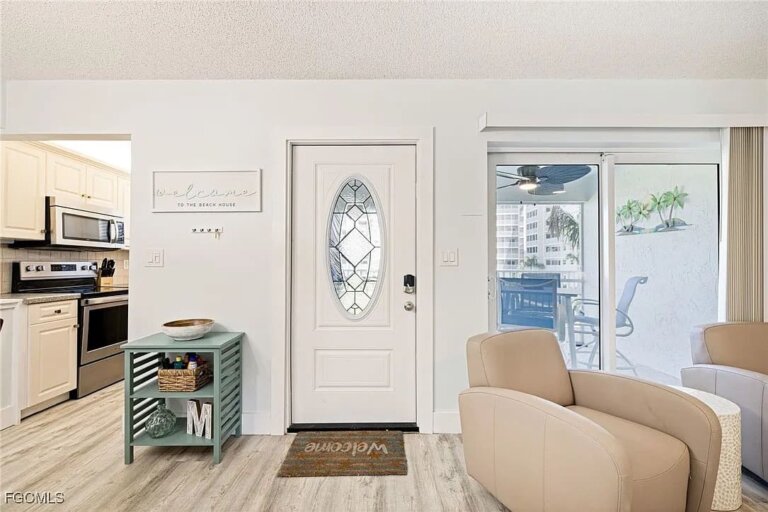 Unit 246 entry and living area with armchair