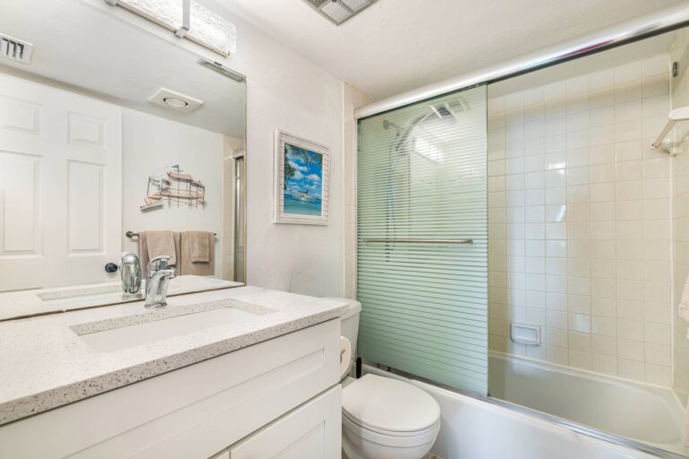 Second bathroom with a tub and shower combination