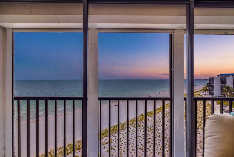 Gulf coastline at dusk seen from the condo's indoor patio