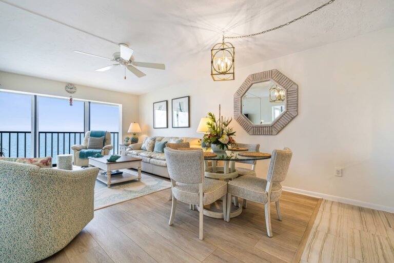 Dining table and living area with Gulf views through the windows