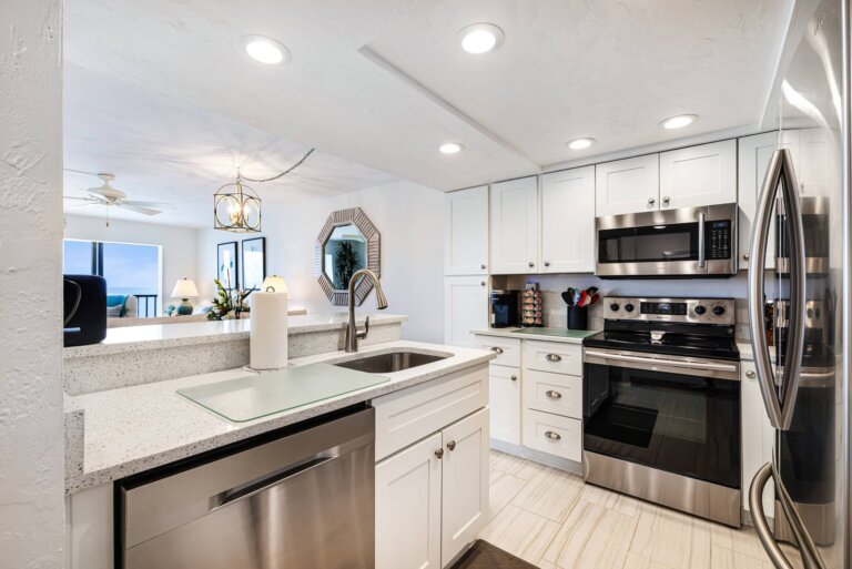 Kitchen with white cabinets, stainless appliances and a dishwasher