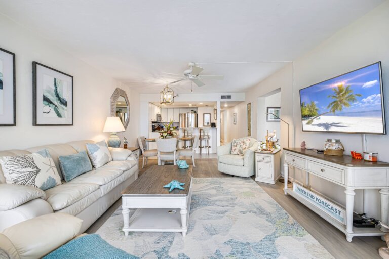 Sofa and chairs arranged around the TV in the living room