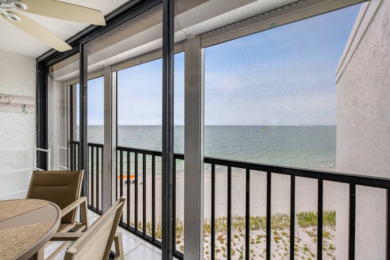 Indoor patio chair overlooking the Gulf and the beach below