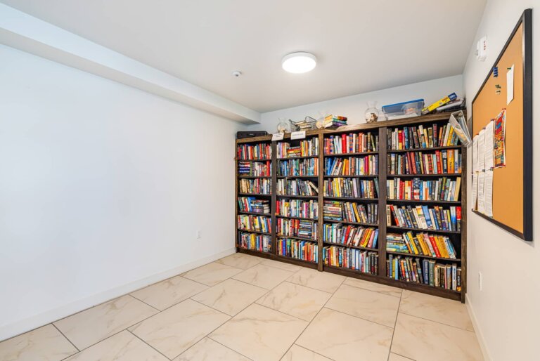 Community library room lined with bookshelves