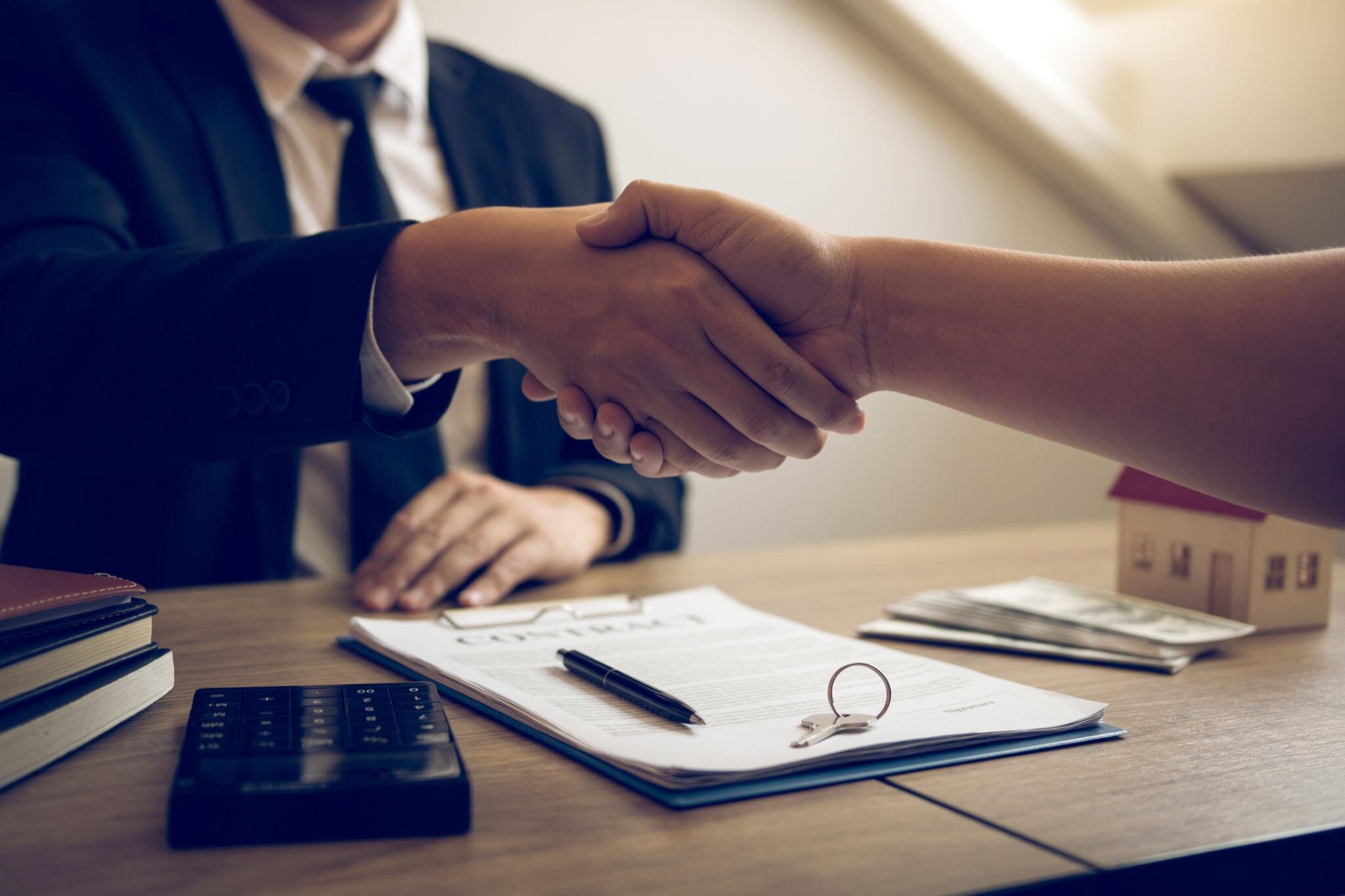 smiling We Buy Utah Homes clients after a cash home sale