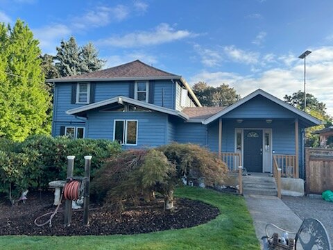 Front exterior of the Hubbard home before painting work began