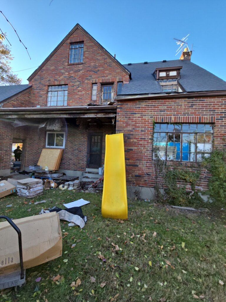 house with a yard full of trash in Dayton