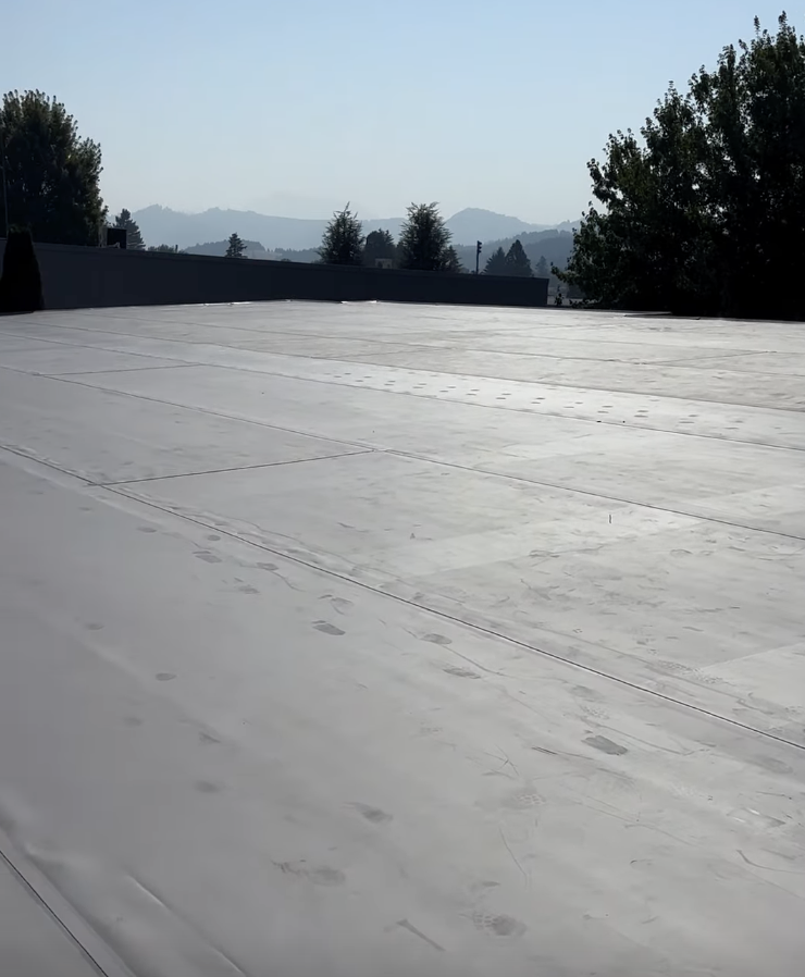 Sutherlin High School flat roof replacement roofing job by Foley Roofing