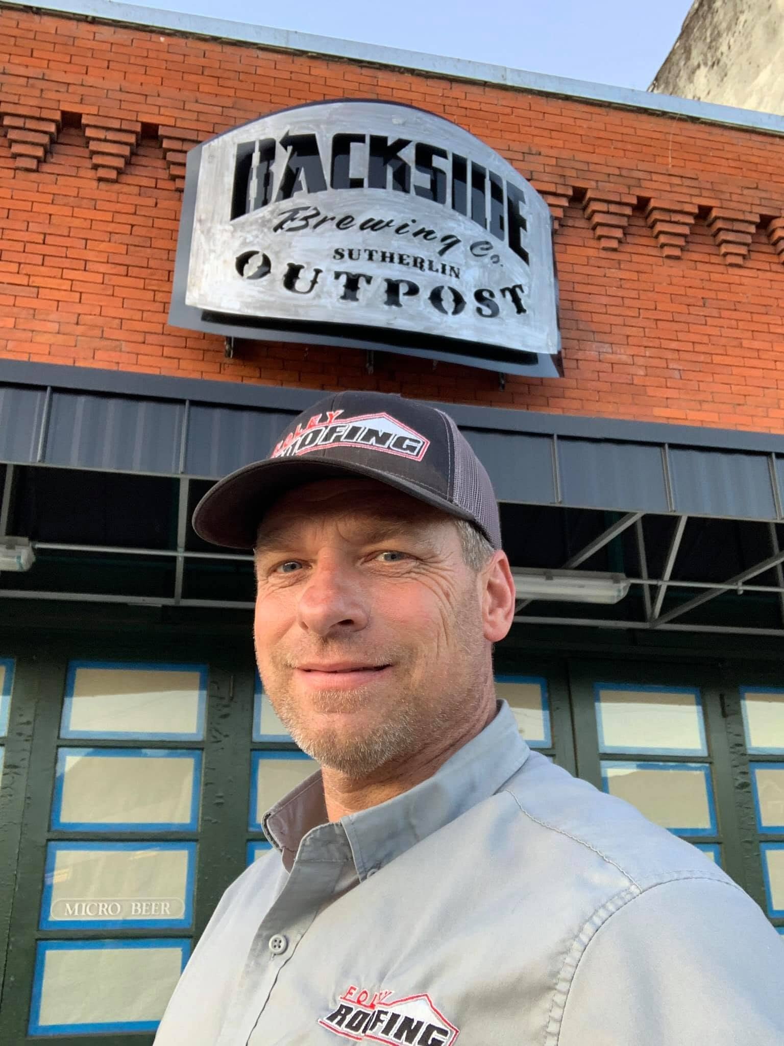 Del Foley at Backside Brewing in Sutherlin after a roofing repair job