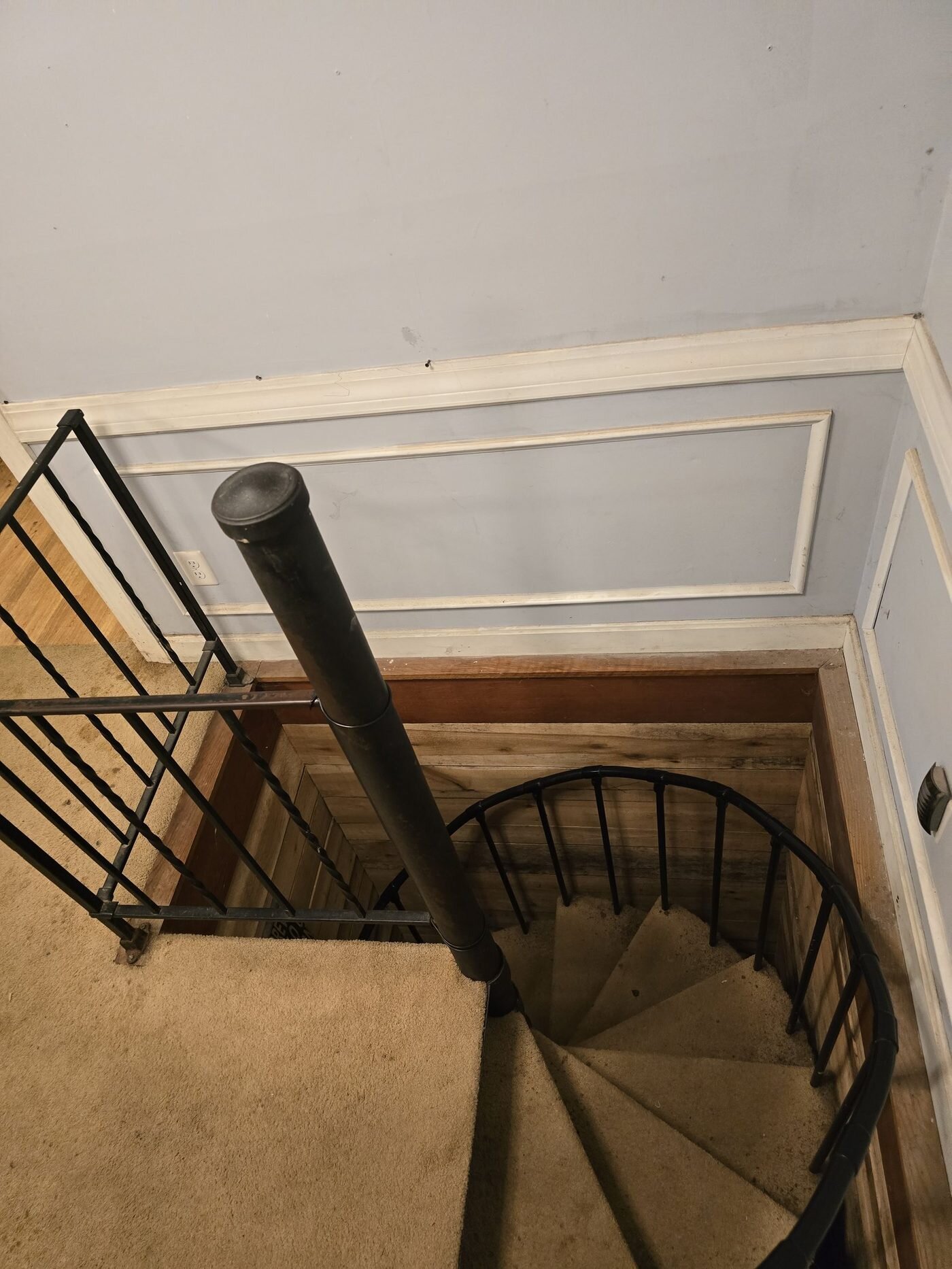Dated interior stairwell of an older Louisville home sold as-is during foreclosure