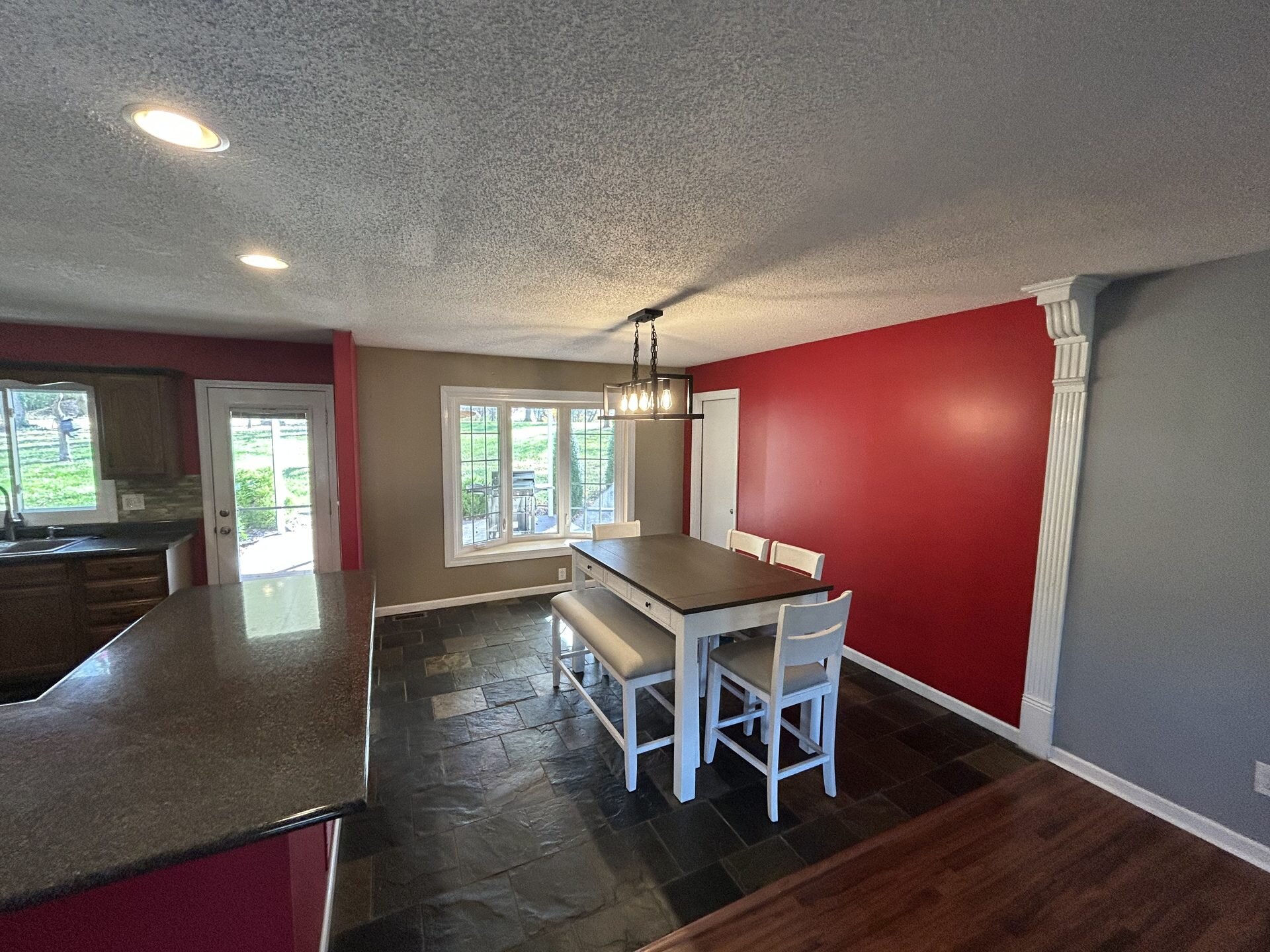 Updated open-concept kitchen and dining area in a Georgetown, Indiana home bought by Howard Buys