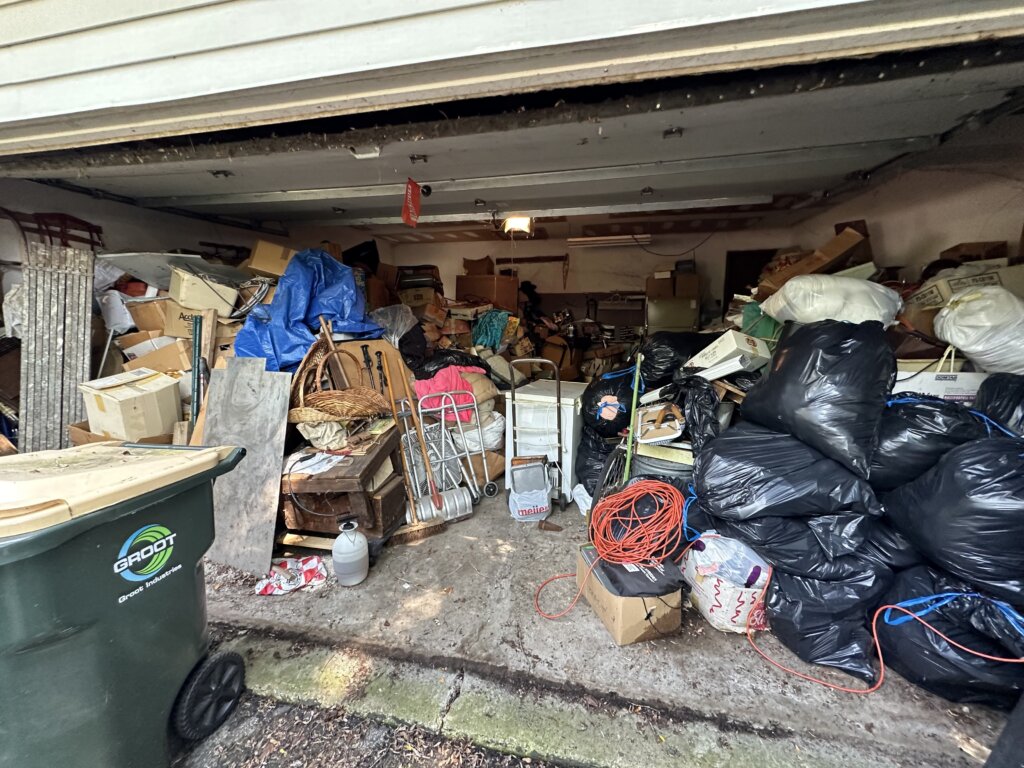 Cluttered garage full of belongings, example of a Lake County property before renovation.