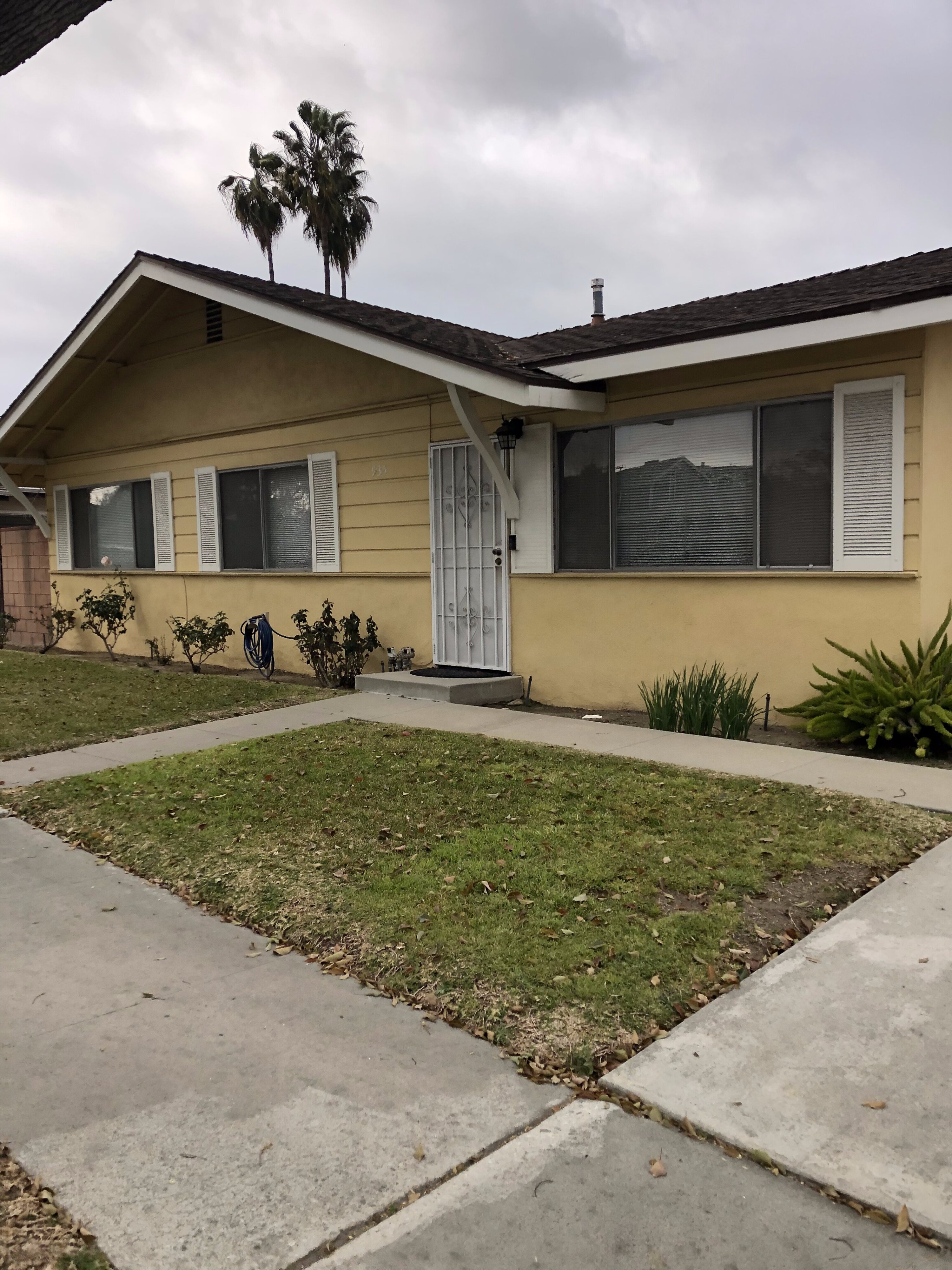 Duplex property in Monrovia, California with front lawn and sidewalk