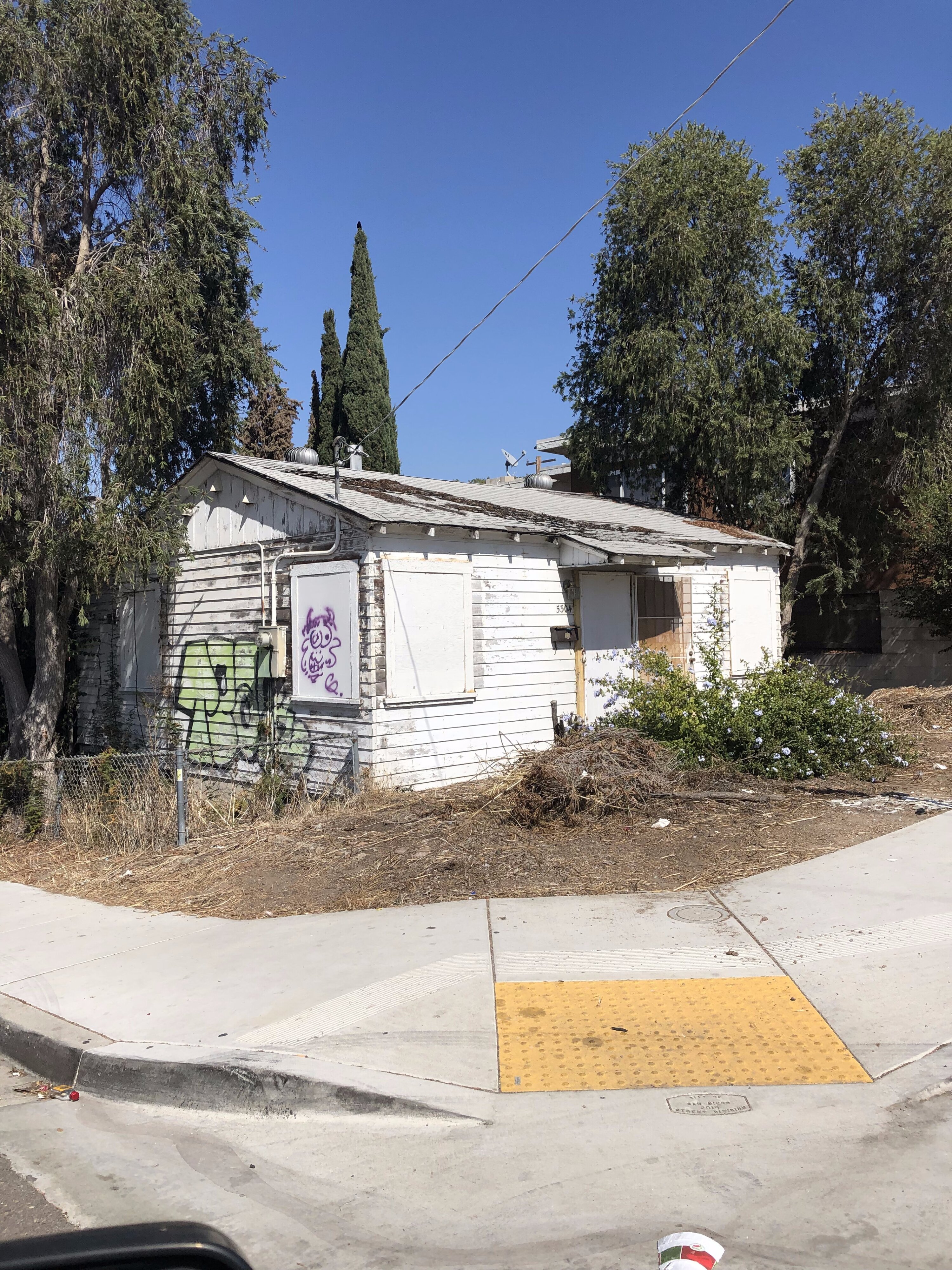 Bluesky Homes buys older homes that need repairs like this boarded up house