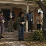 Six relatives standing on the porch of an inherited brick house in Birmingham, each holding paperwork