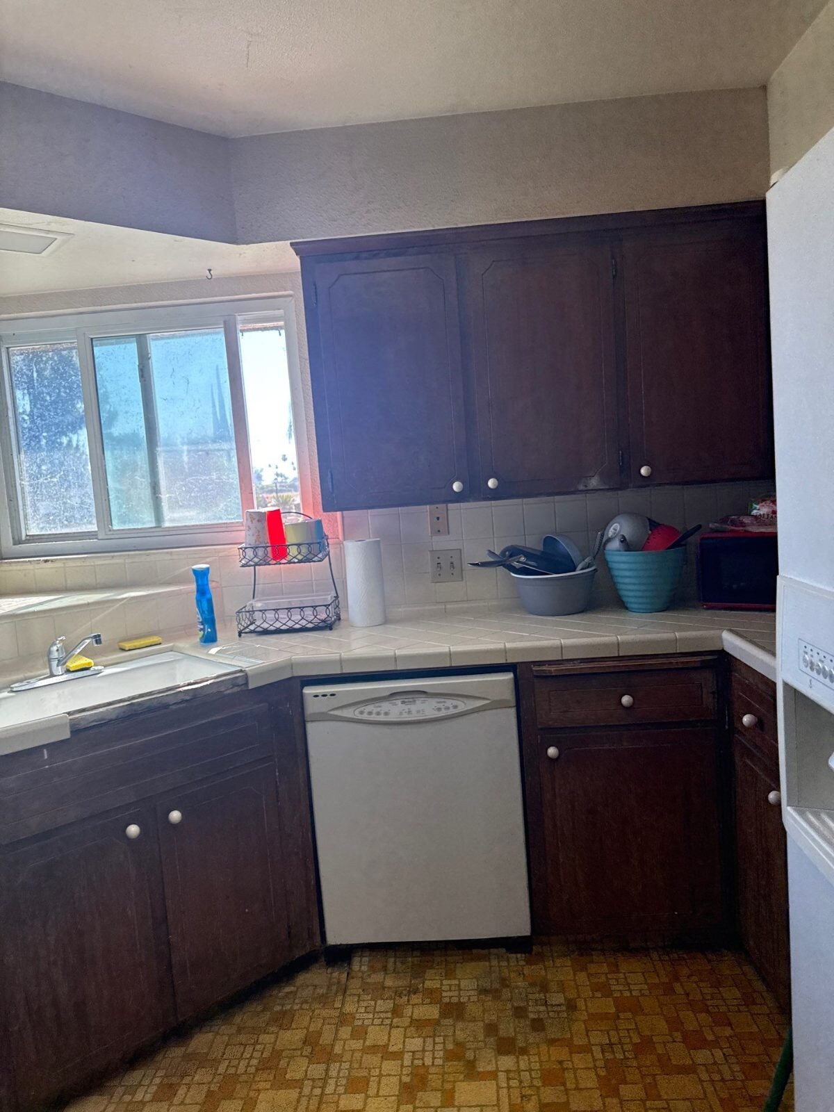Original dark-wood kitchen in a Fowler house sold as-is