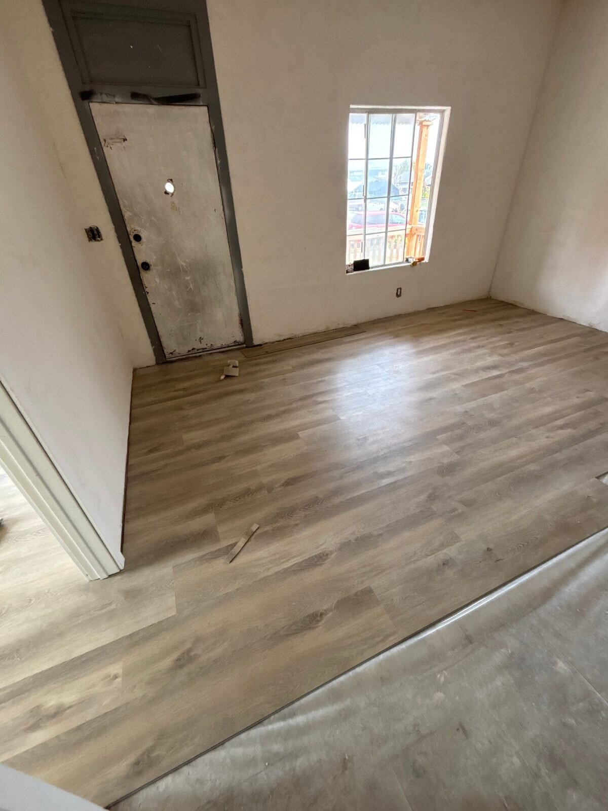 Fresno bedroom with new plank flooring after our renovation