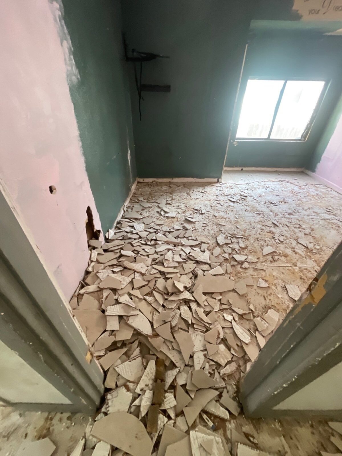 Old tile floor torn out in an older Fresno house we bought as-is