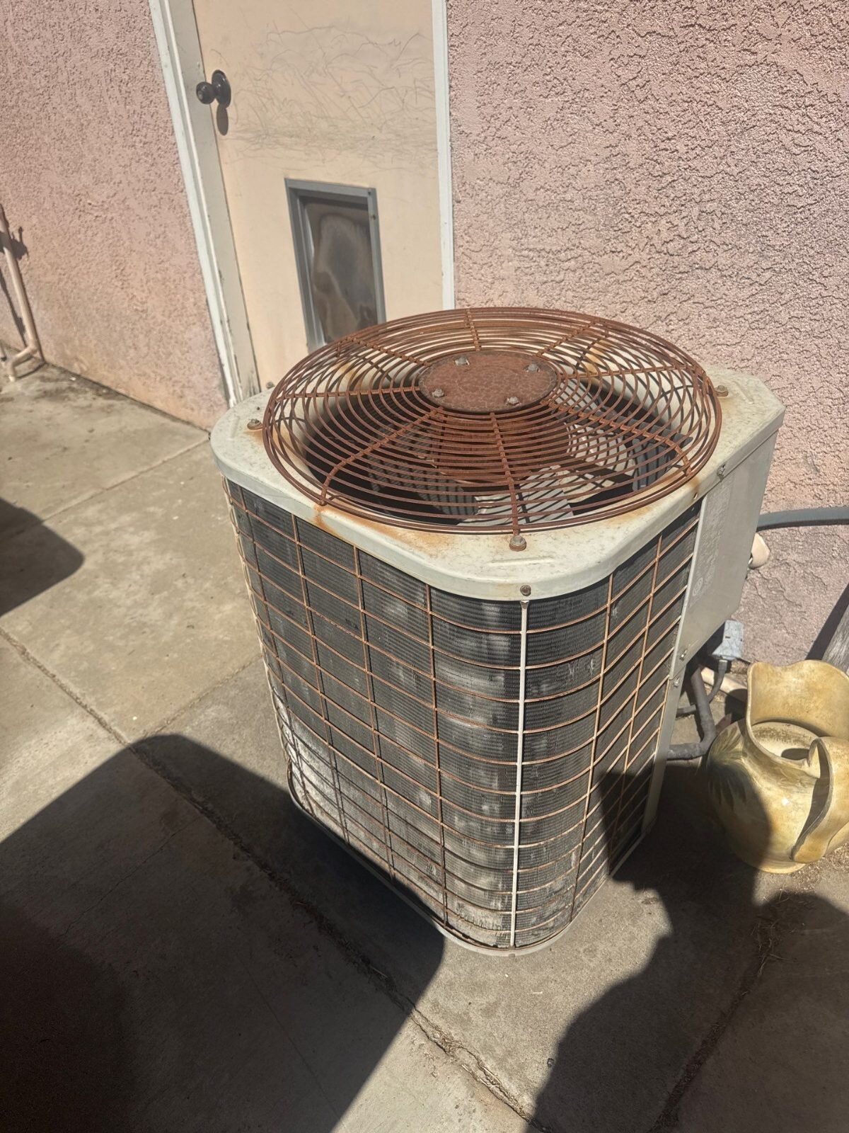 Rusted, aging AC condenser at a Salida house we bought