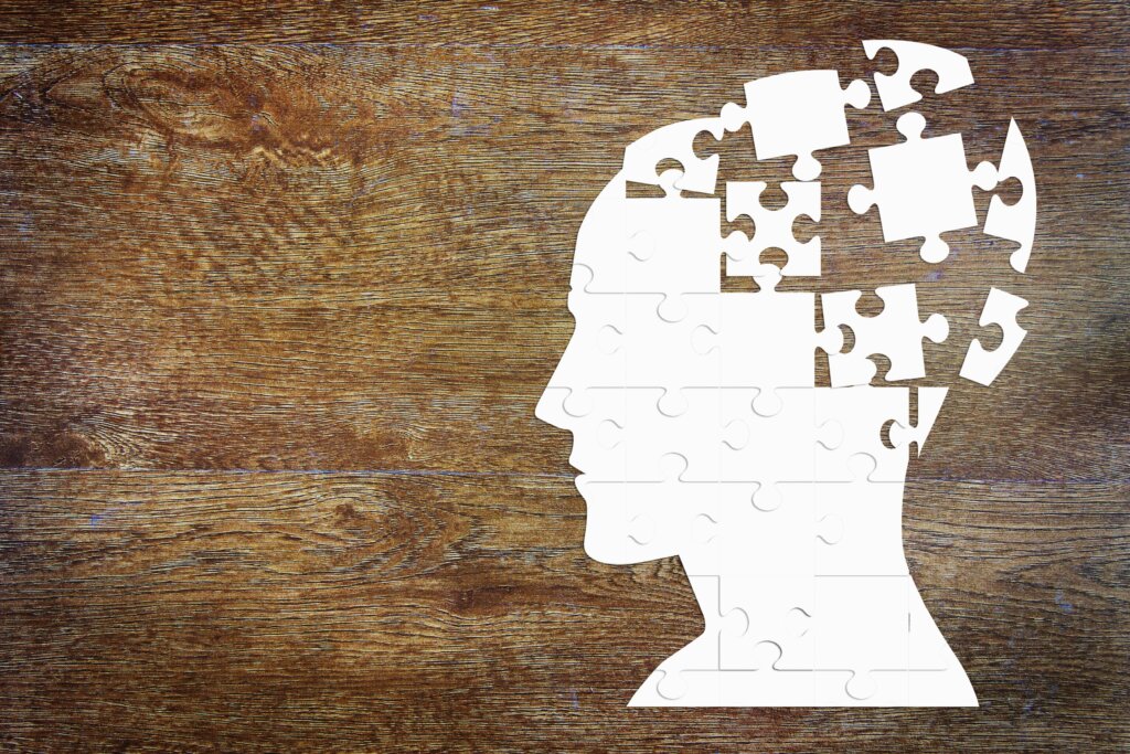 Puzzle-piece silhouette of a head