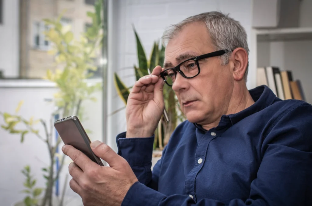 Social Media Marketing - Boulder SEO Group - Adult Man Looking at Phone