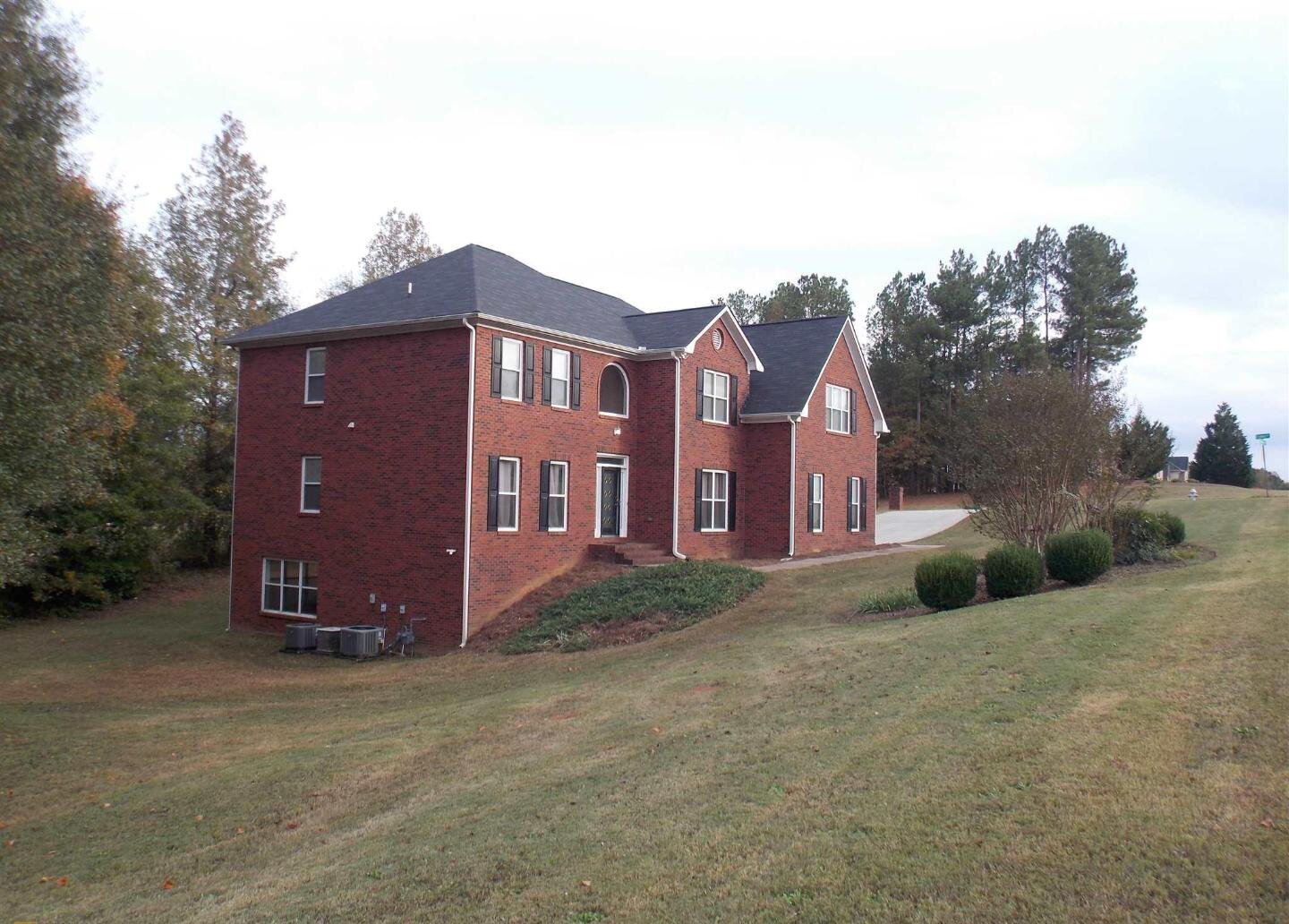 Two-story brick home with a two-car garage and finished basement