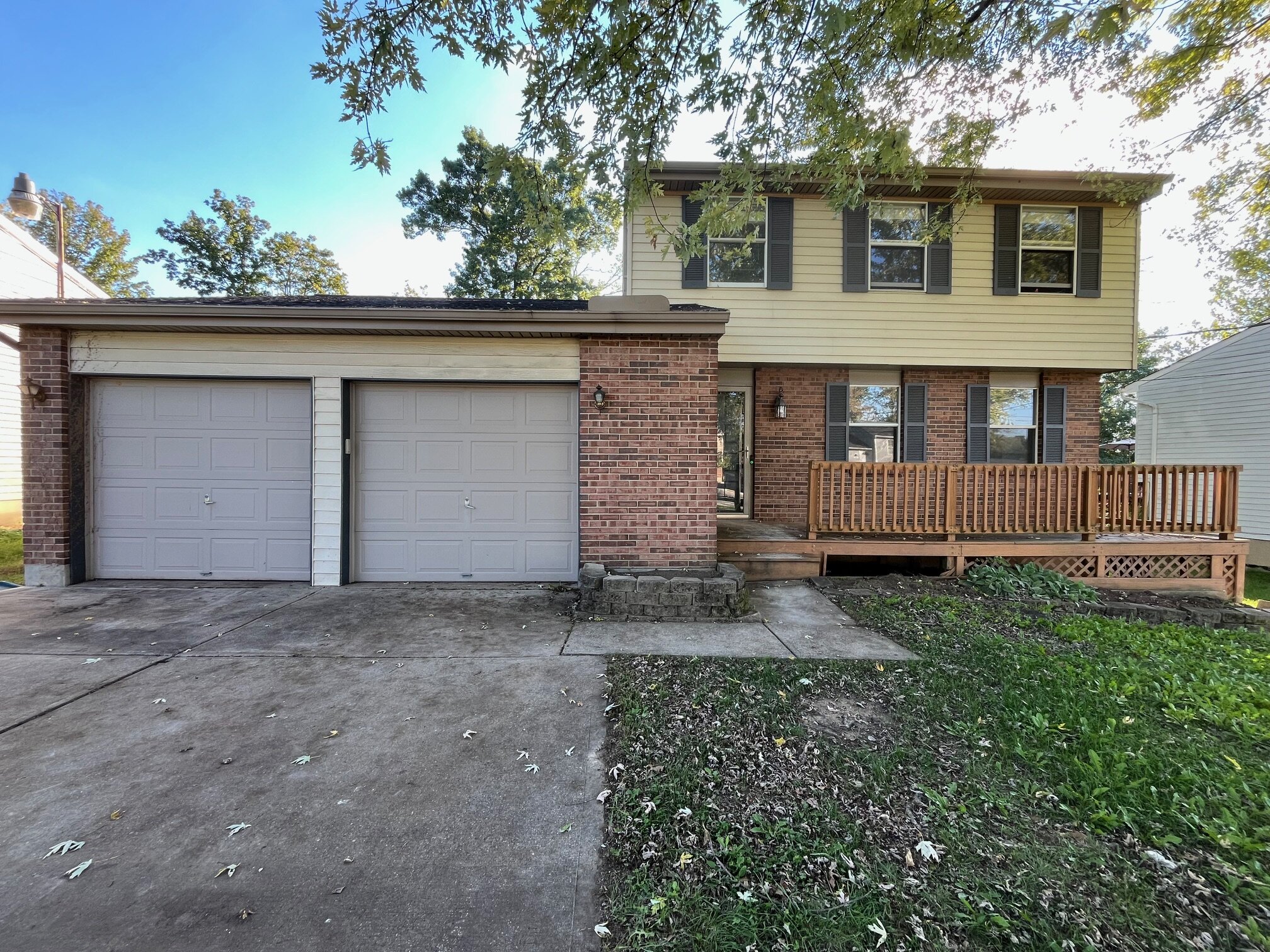 smiling Landmark Home Buyers clients after a cash home sale