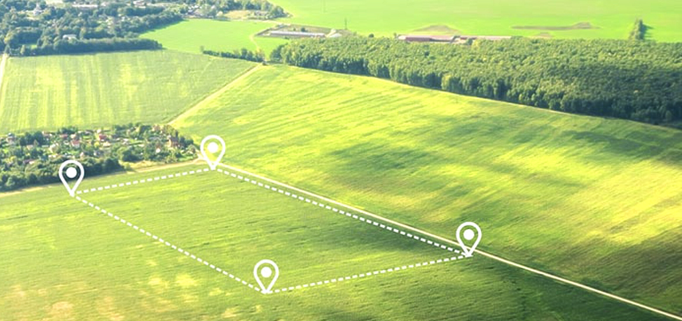 Aerial view of Canadian farmland parcel with boundary markers