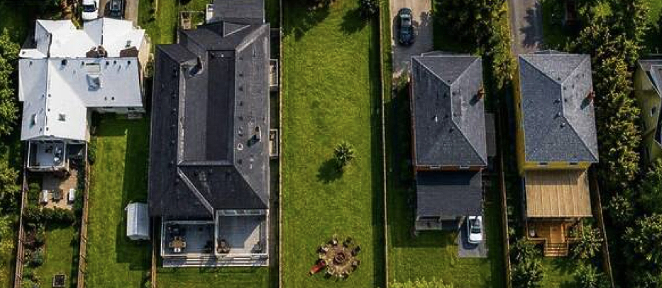 Aerial view of a vacant infill lot between homes in Canada