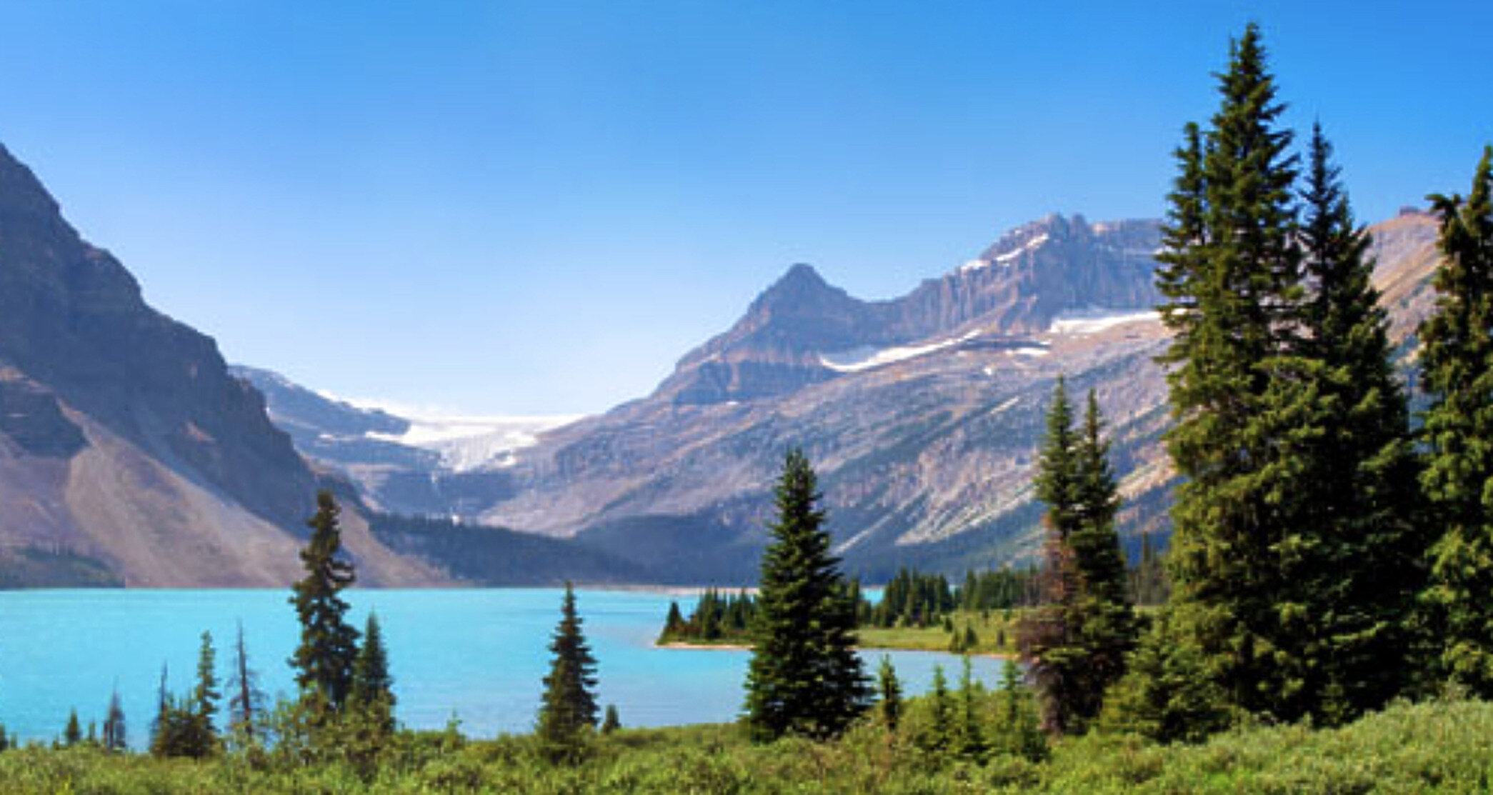 Mountain lake and forested land in the Canadian Rockies