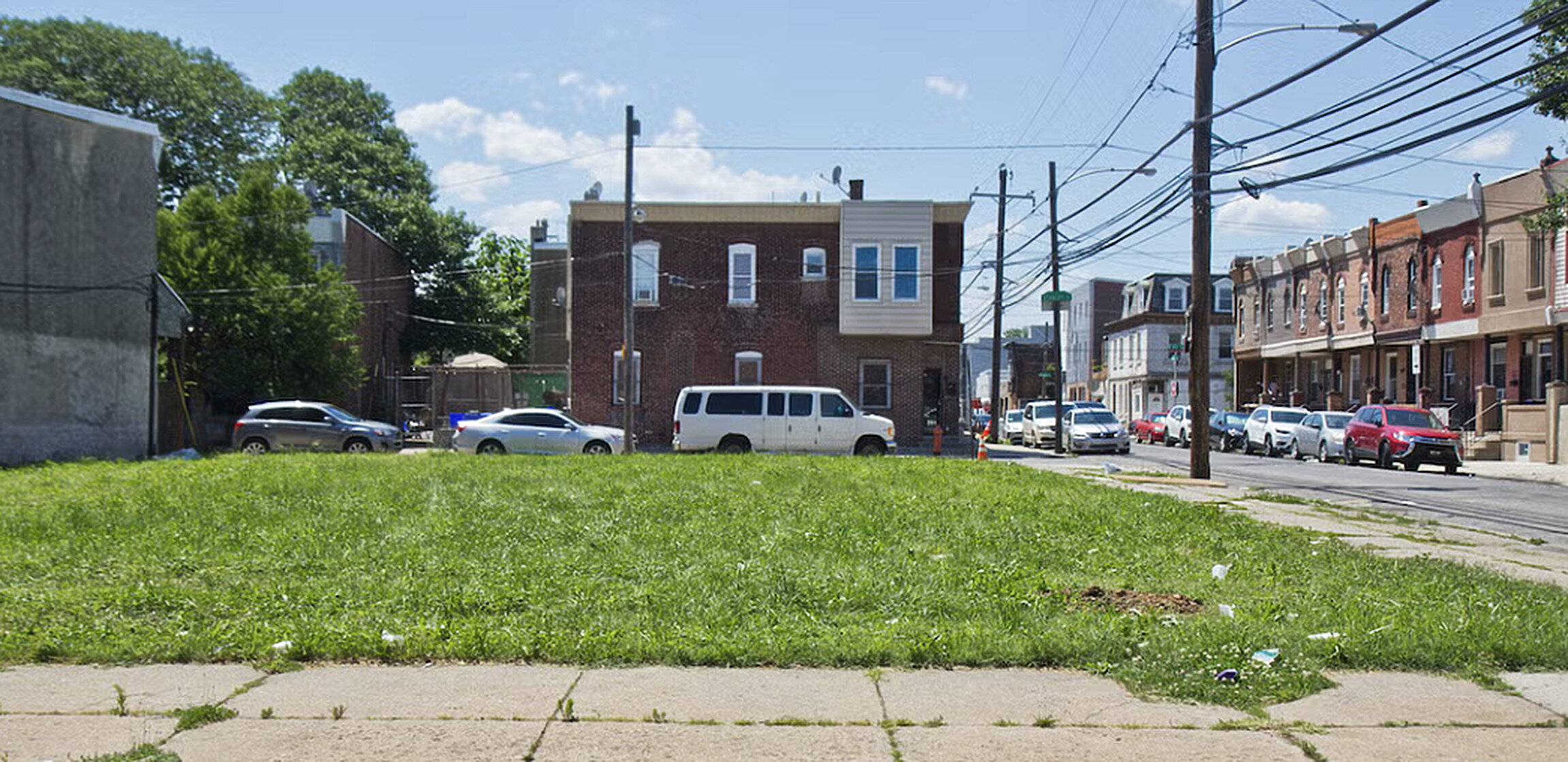 Vacant city lot for sale on a residential street in Canada