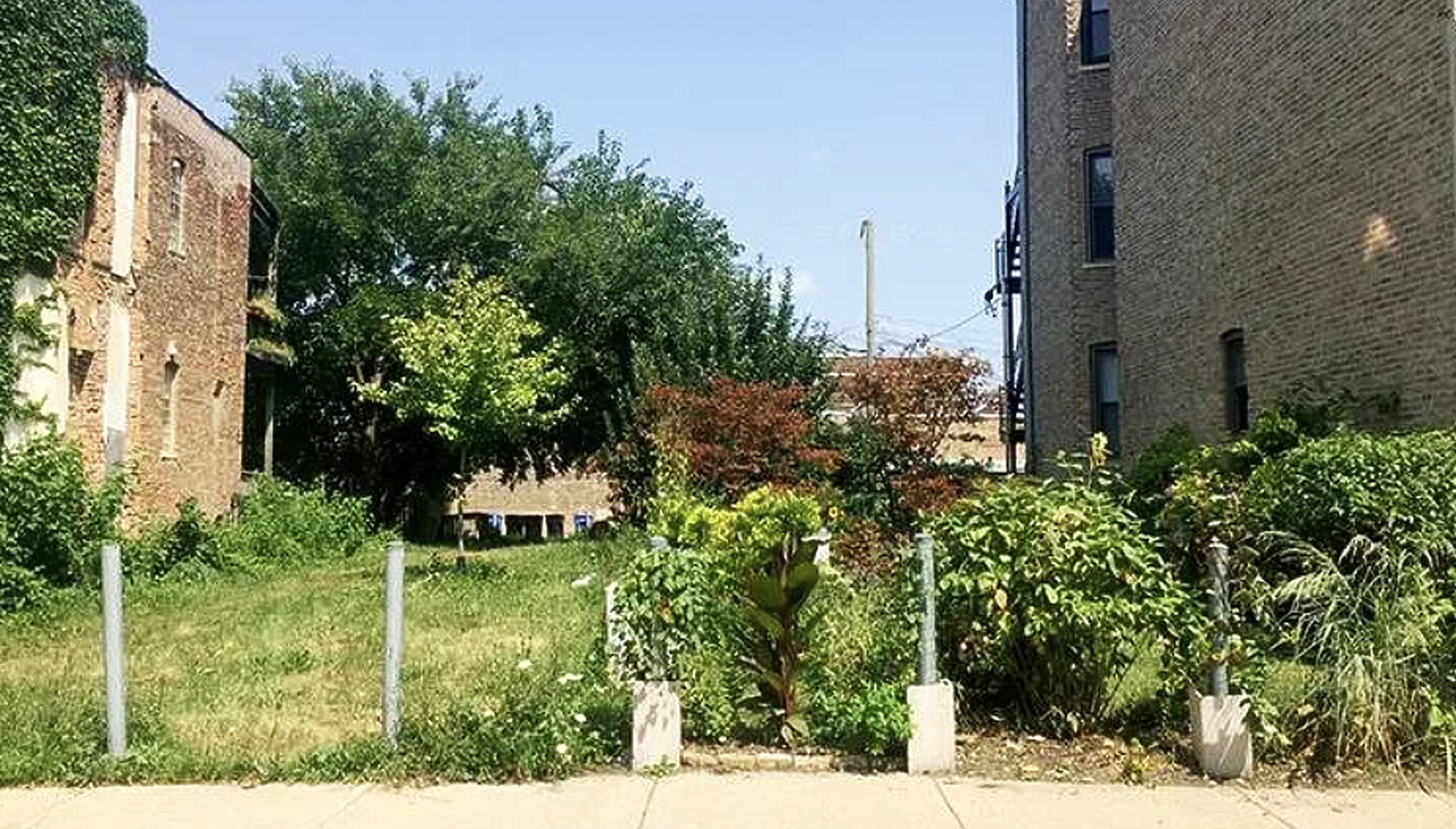 Vacant urban lot for sale between buildings in Canada