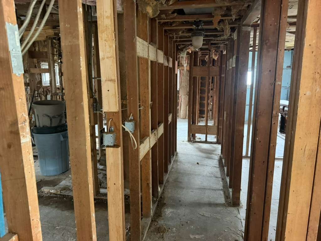 Interior hallway stripped to the framing at Winder Road home