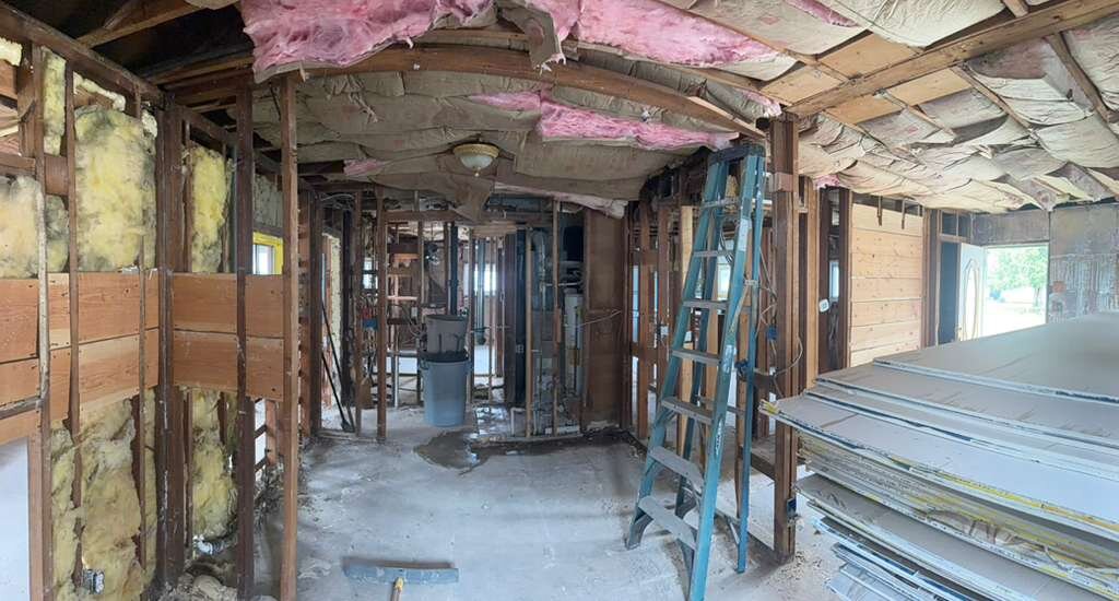 Exposed framing and renovation work inside Winder Road home