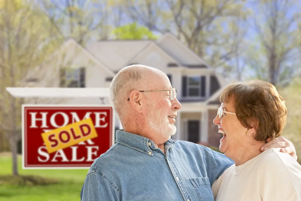 Homeowner discussing options for selling a house as-is with DSKM Enterprises