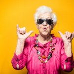 older woman celebrating hand gestures